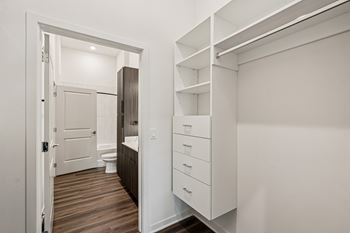 A white bathroom with a toilet and sink